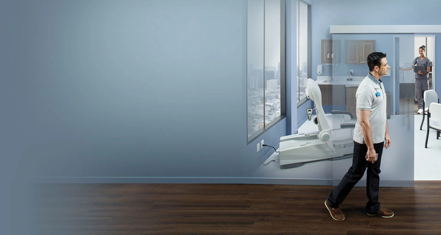 person walking through an exam room