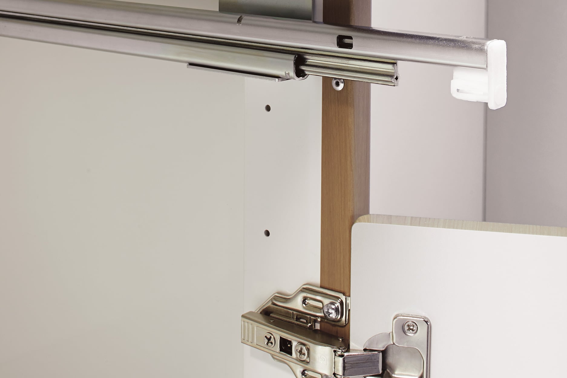 close up of door hinges on cabinets in medical exam room