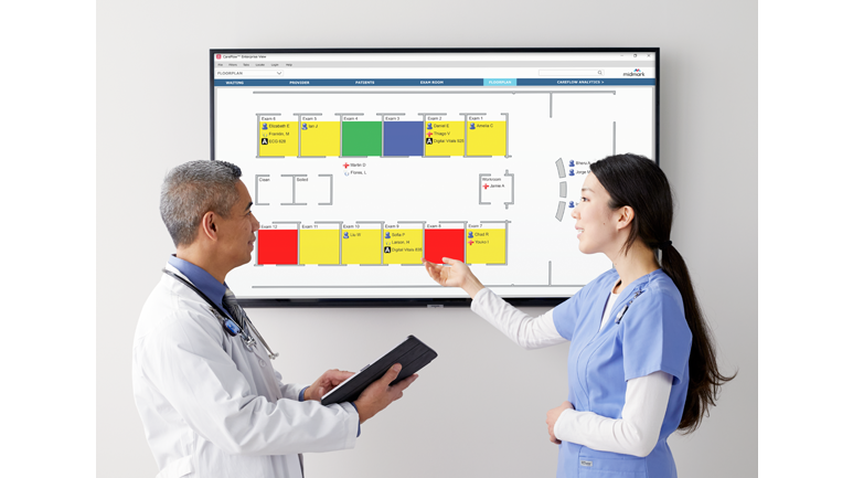 Doctor and Nurse Viewing a Floorplan