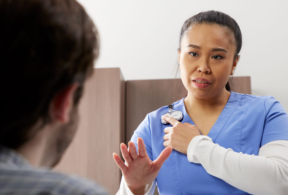 Nurse speaking with patient