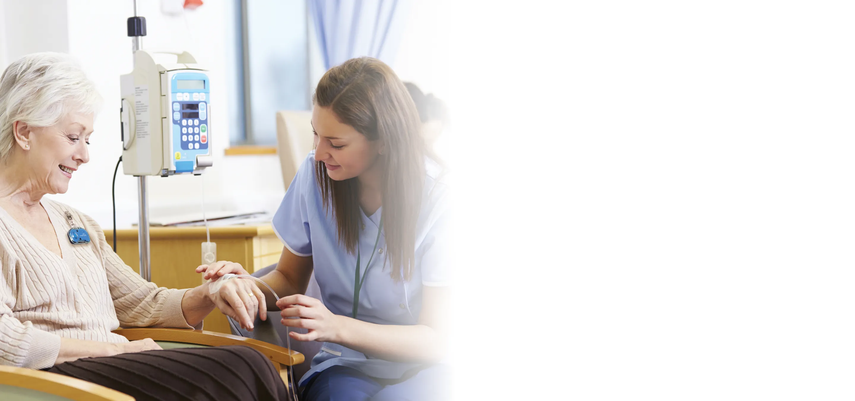 nurse helping patient with iv