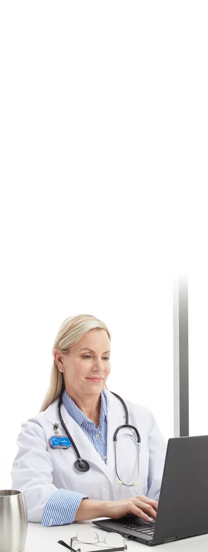 doctor typing on laptop