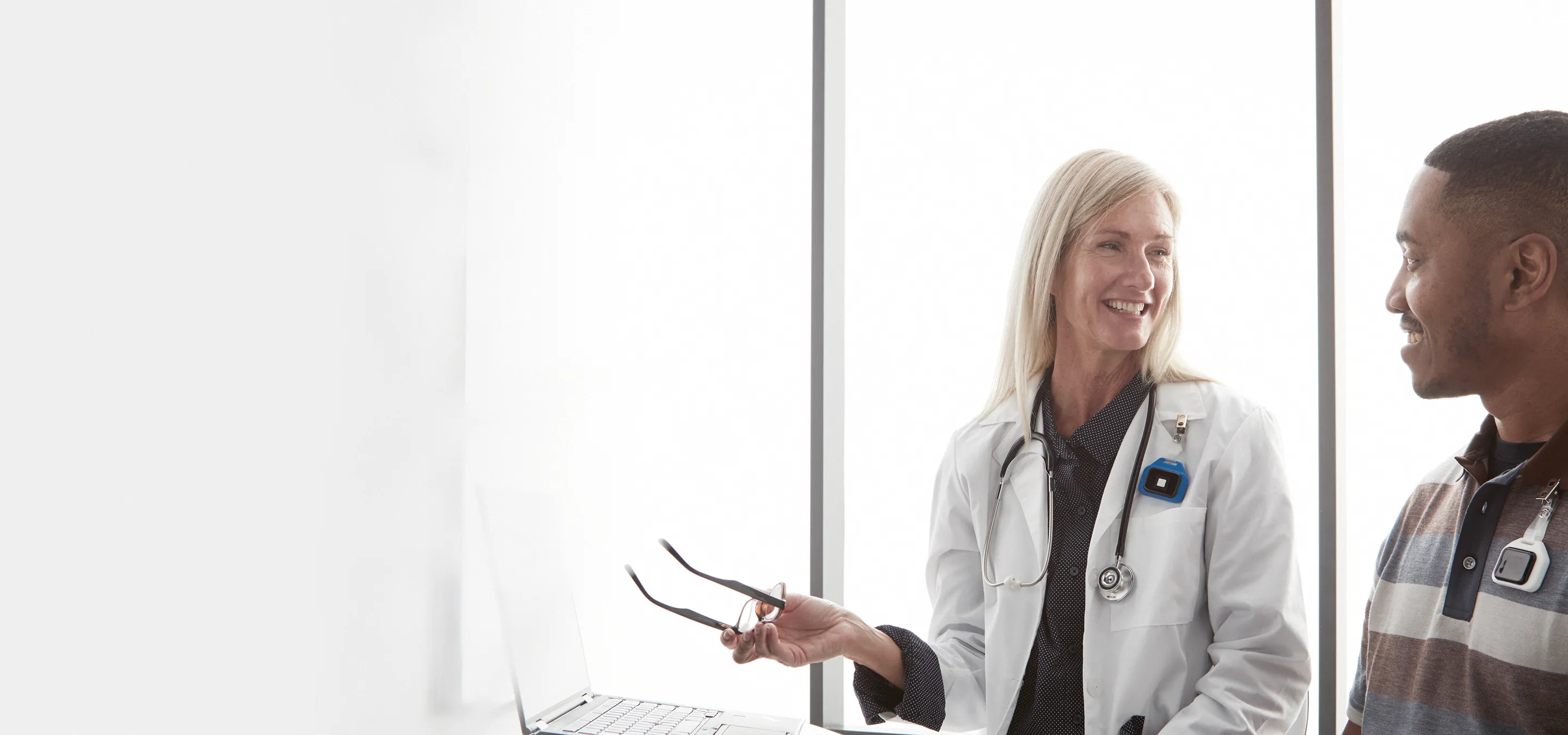 doctor and patient wearing midmark badges