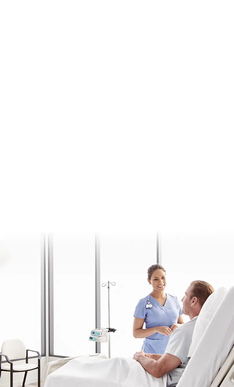 nurse wearing a midmark rtls badge talking to a patient