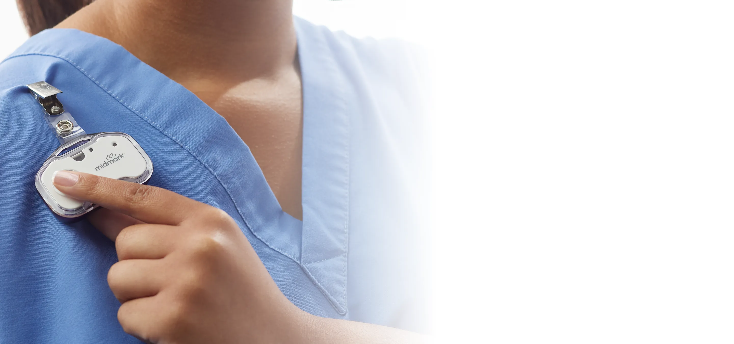 nurse pressing midmark rtls badge