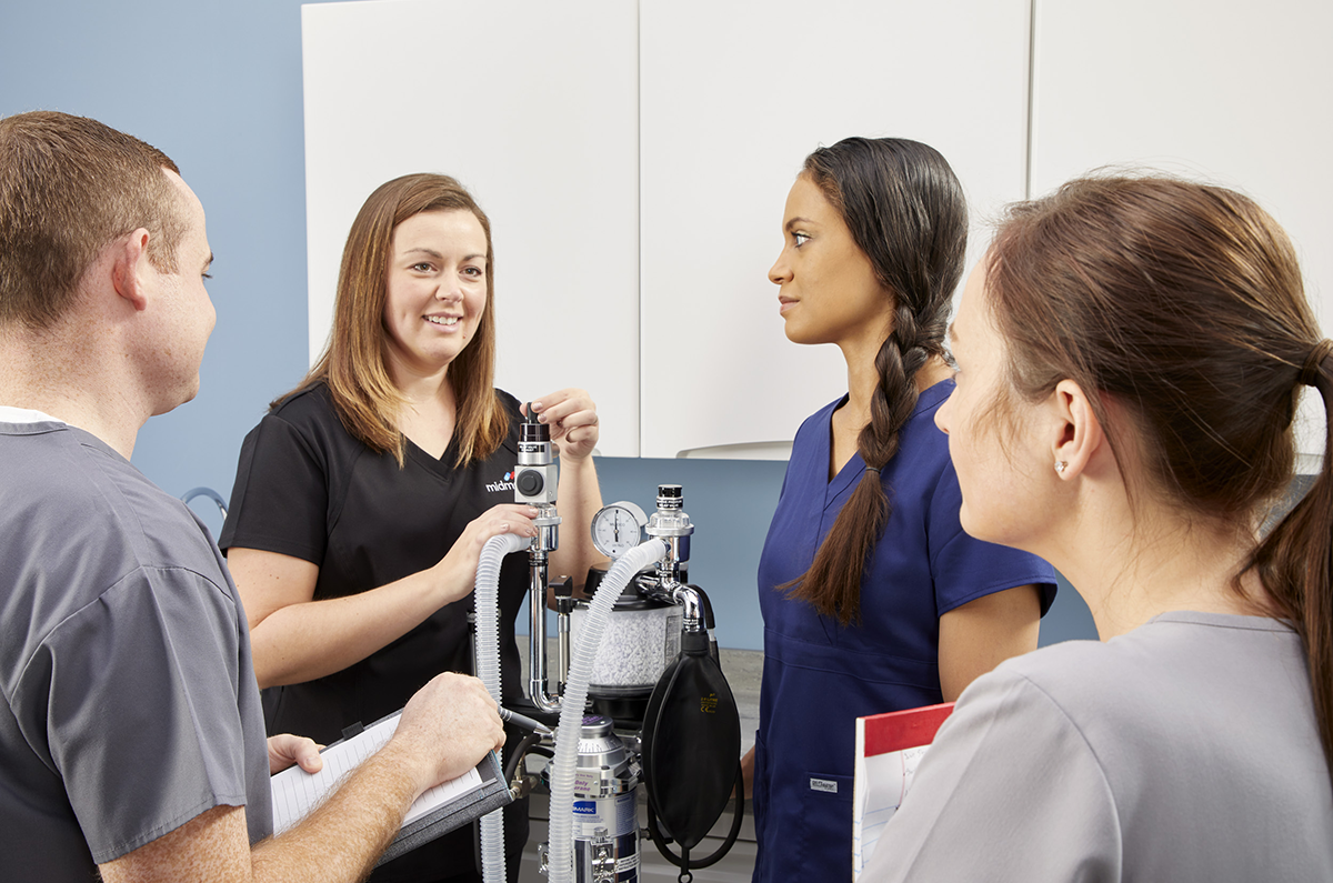 Vet Technicians training on anesthesia machine