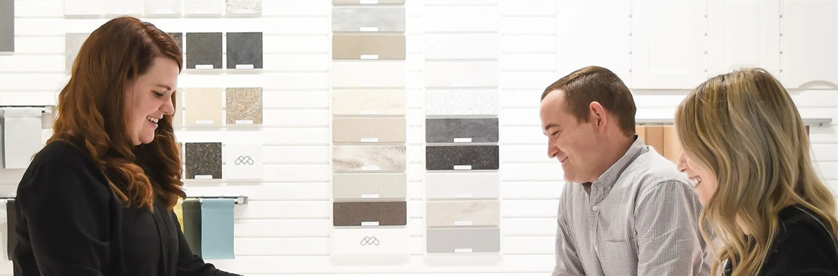 midmark employee showing color samples to customers