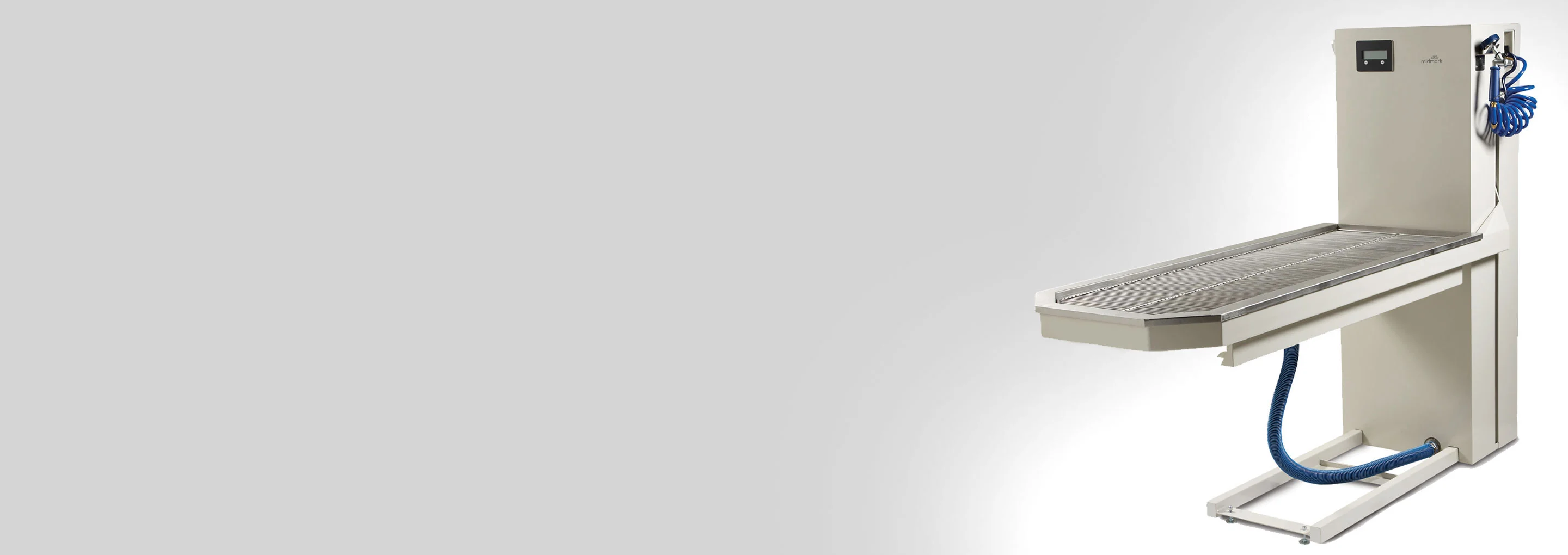midmark lift table on grey background