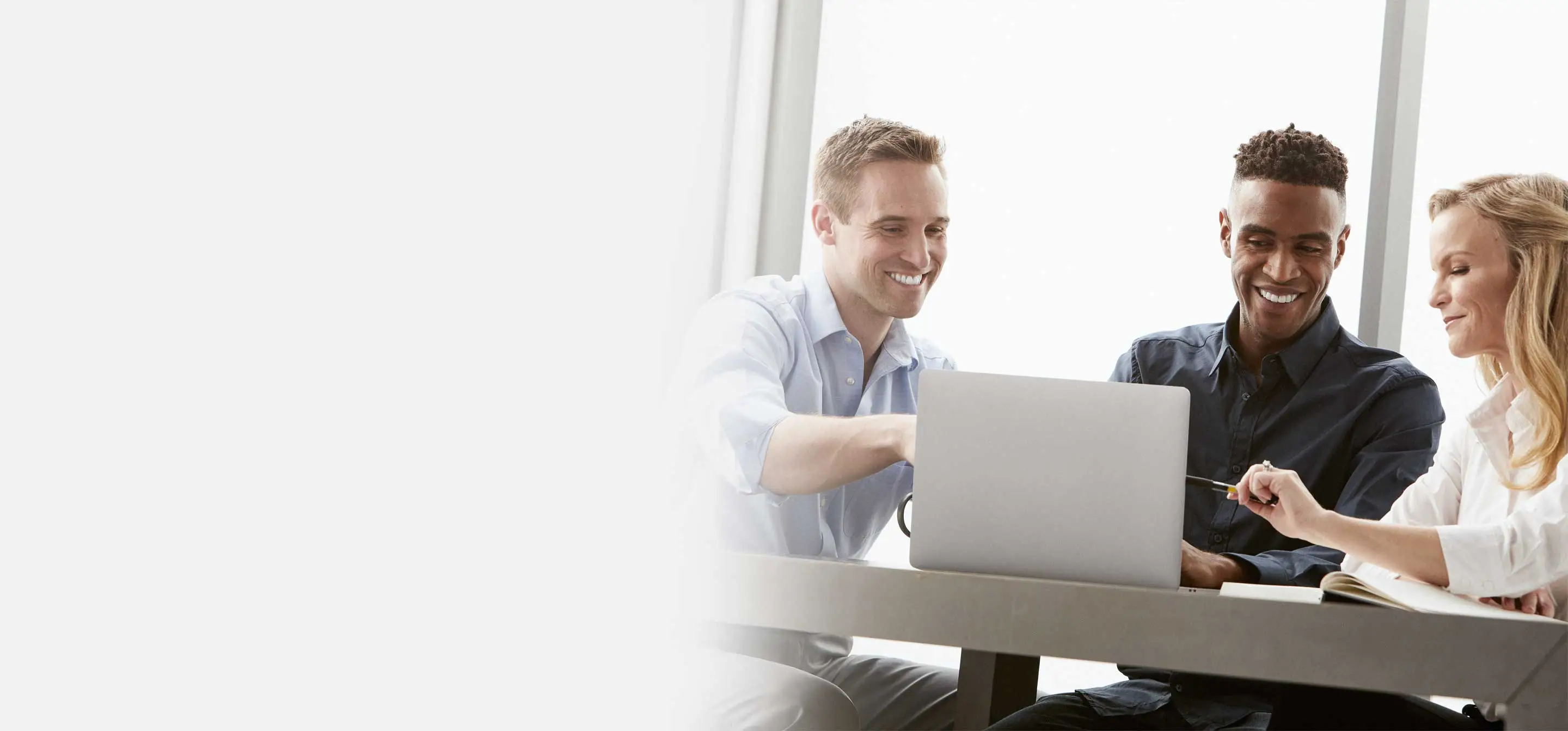 midmark teammates looking at laptop