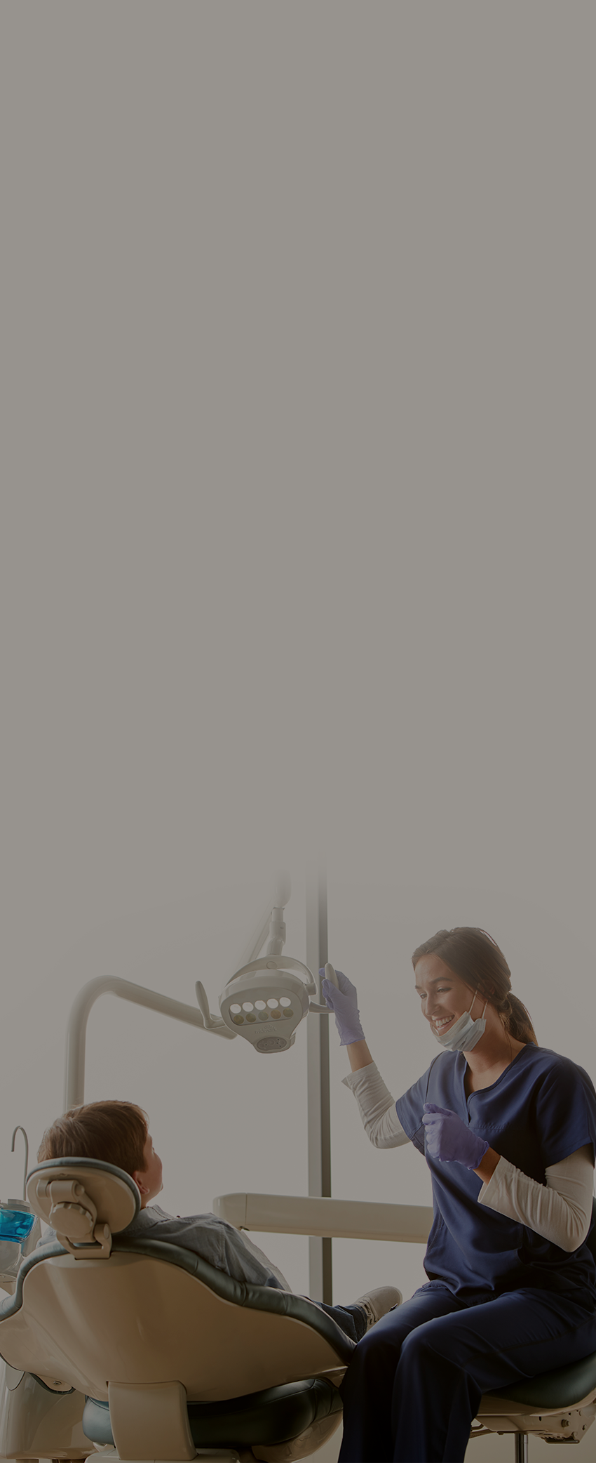 Dental assistant with patient