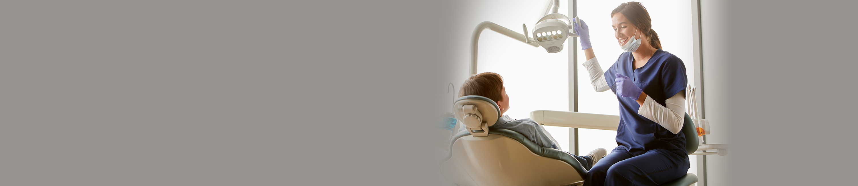 Dental assistant with patient