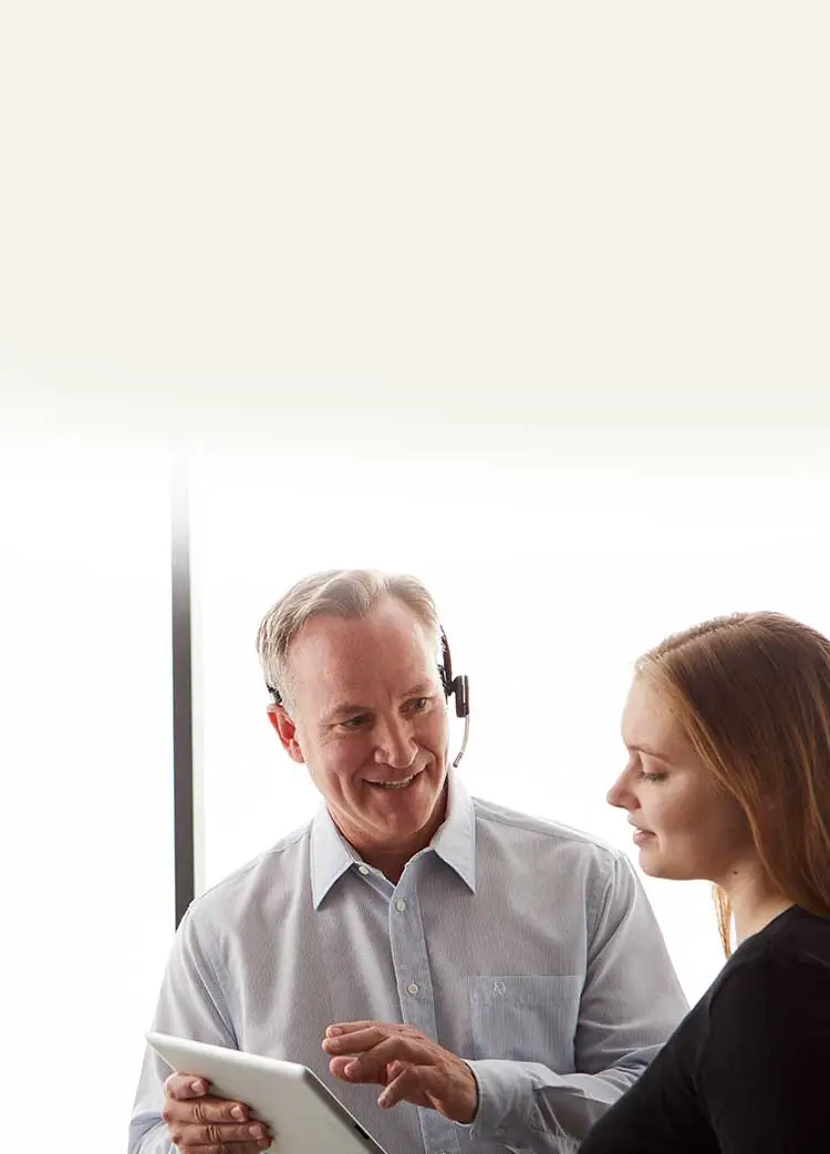 man holding a tablet and helping a customer
