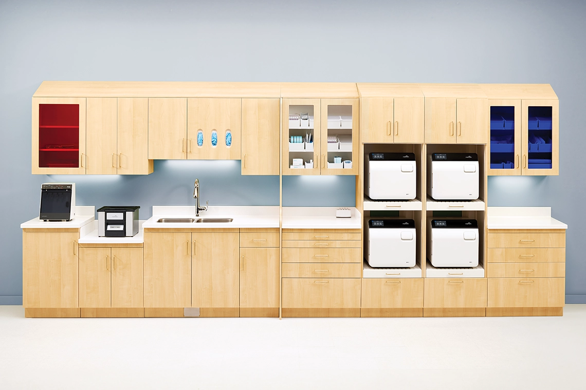 Instrument processing center with four Midmark steam sterilizers arranged to support practice capacity and workflow