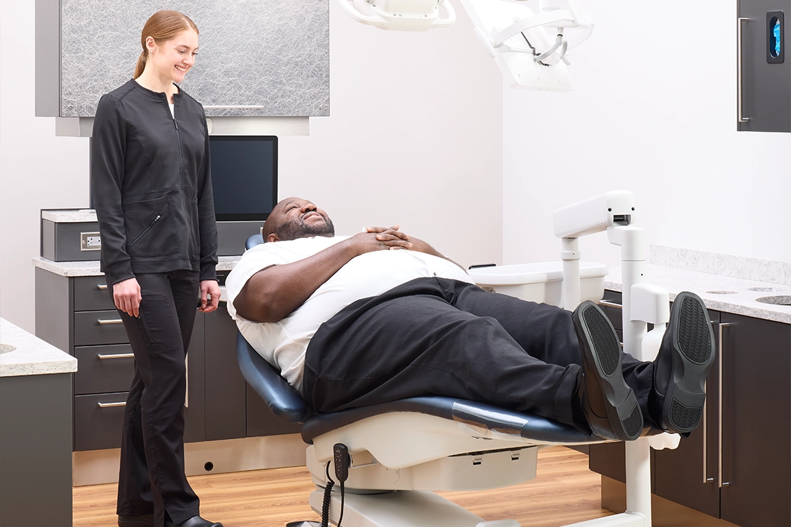 2026-june-blog-2-image-why-consistency-matters Patient reclining comfortably in a Midmark Dental Chair designed to provide consistent movement and support for patients up to 500 lb.