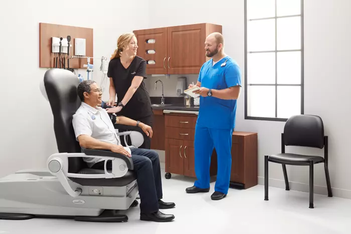 two dentists checking on patient