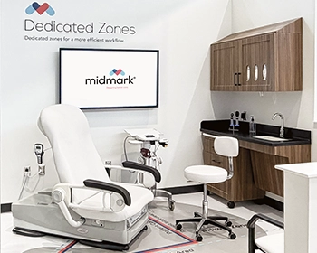Midmark showroom display demonstrating a dedicated zones medical exam room layout with printed floor markings to optimize workflow efficiency.