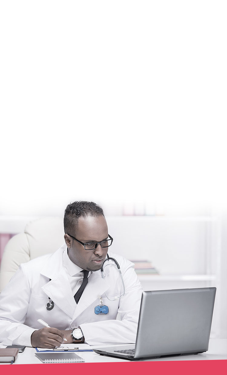 Doctor taking notes at laptop