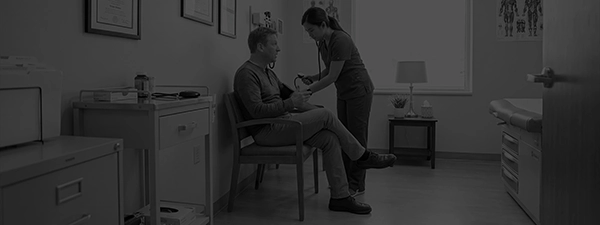 Patient getting BP taken in a standalone chair