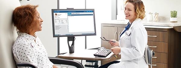 Doctor speaking with patient face-to-face, fully connected experience