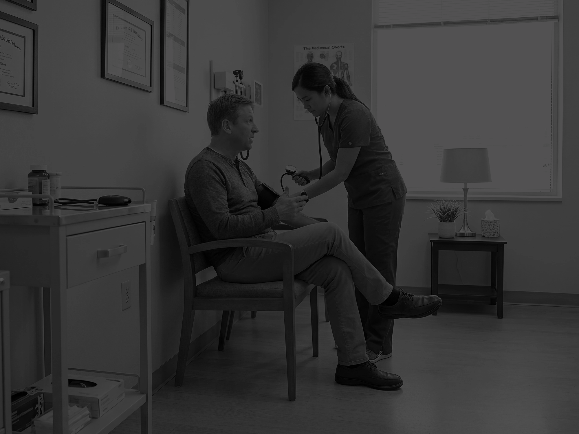 Patient getting BP taken in a standalone chair