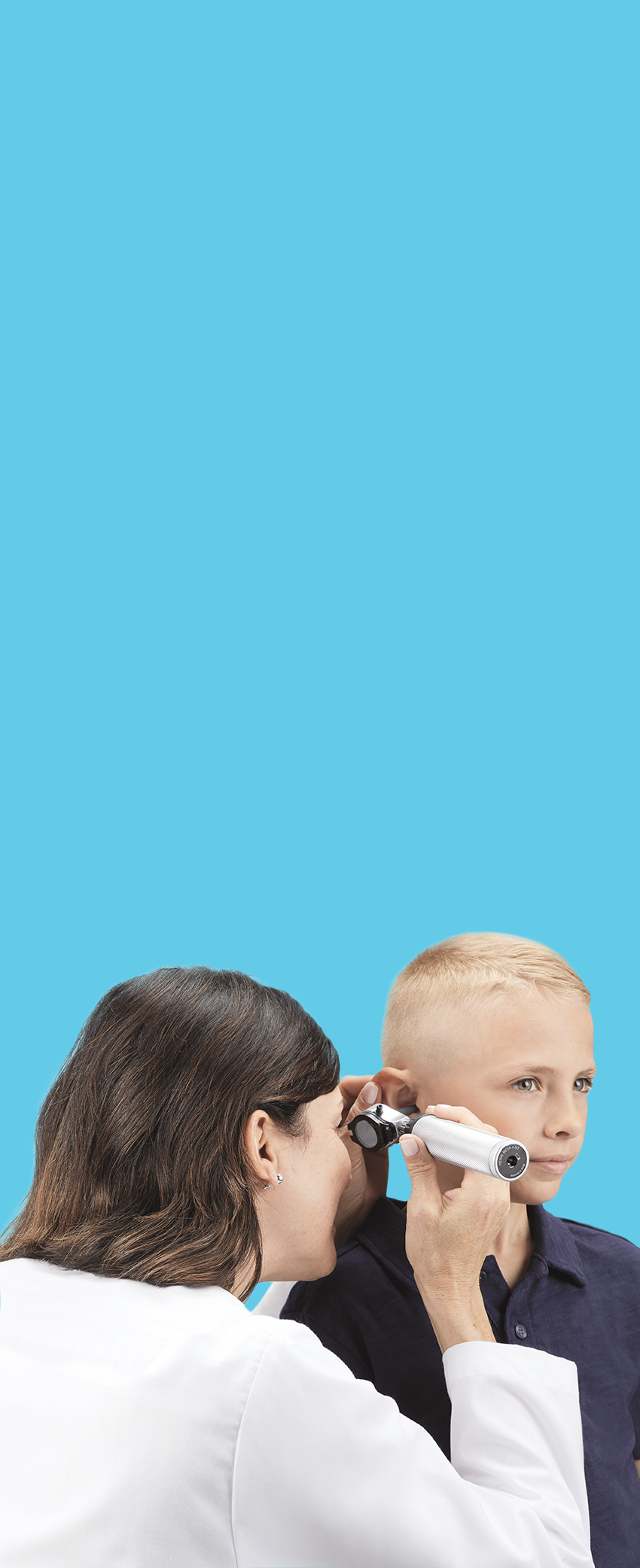 doctor looking into patient's ear