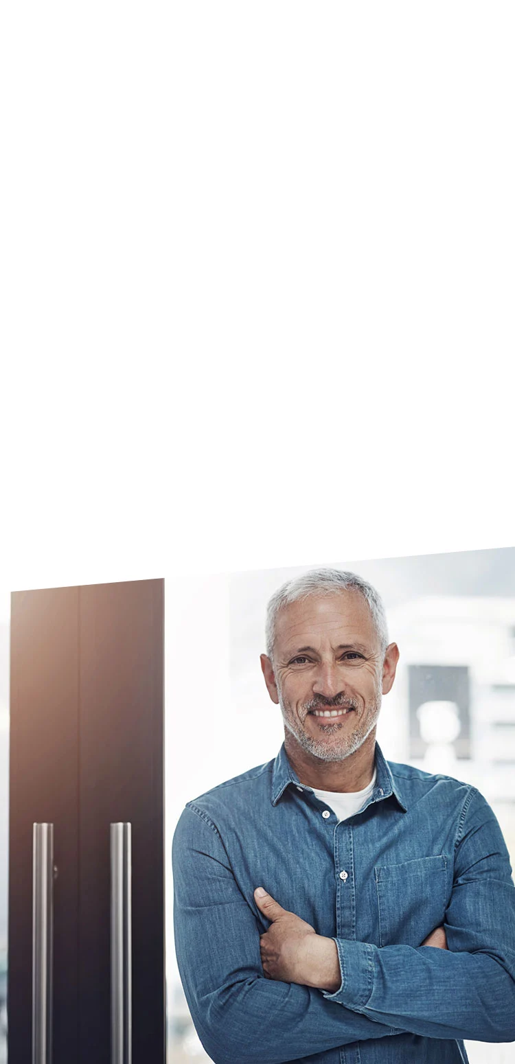 man standing outside doors to medical facility