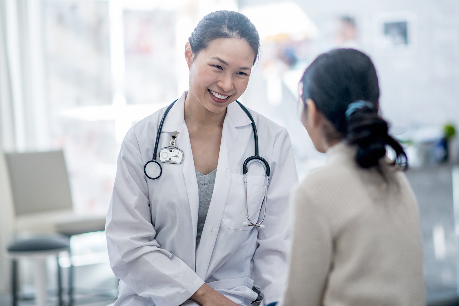 doctor speaking with patient