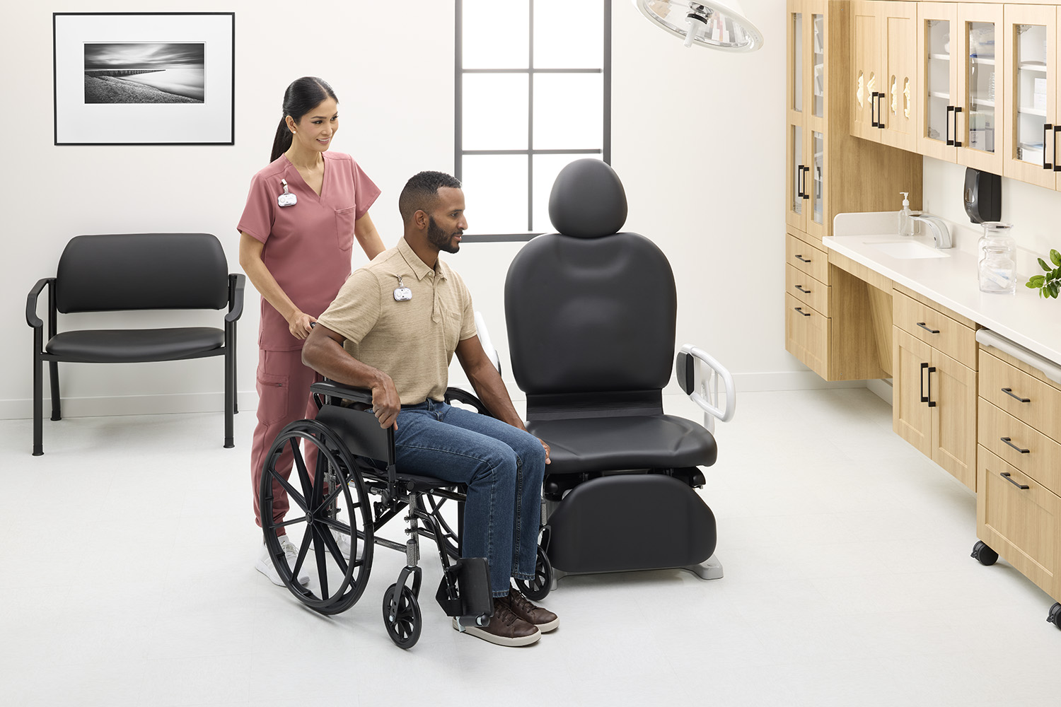 MA pushing patient in wheel chair over the the Midmark 631 Procedure