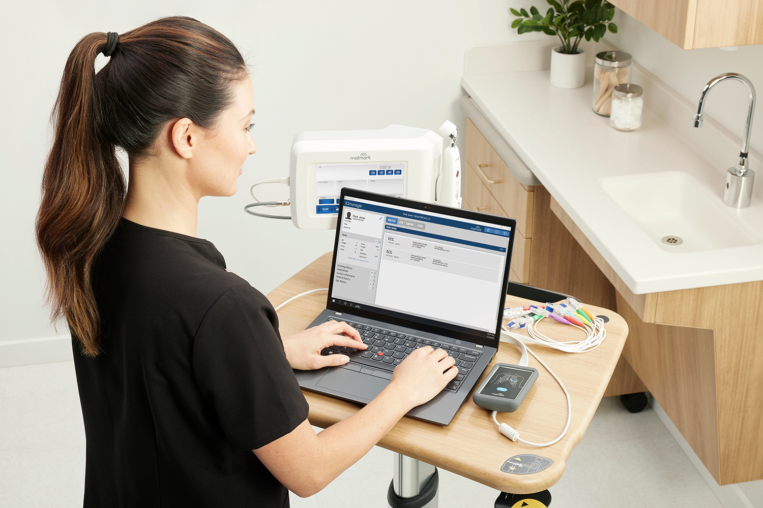Clinician operating the Midmark software for the Digital ECG