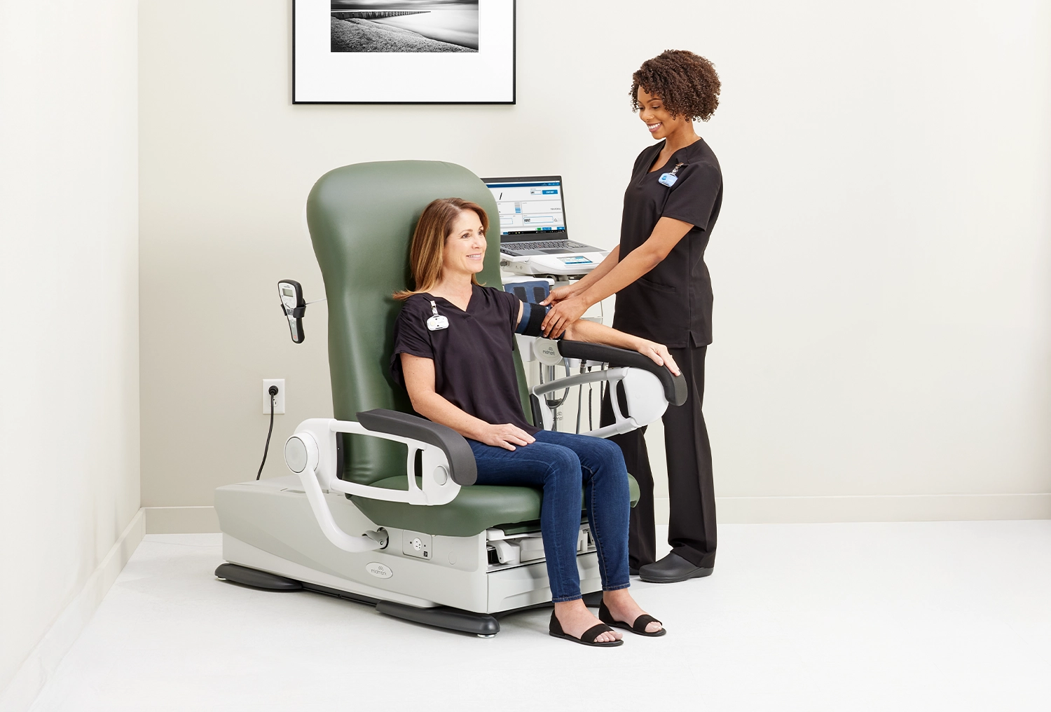 MA wrapping BP cuff on patients arm