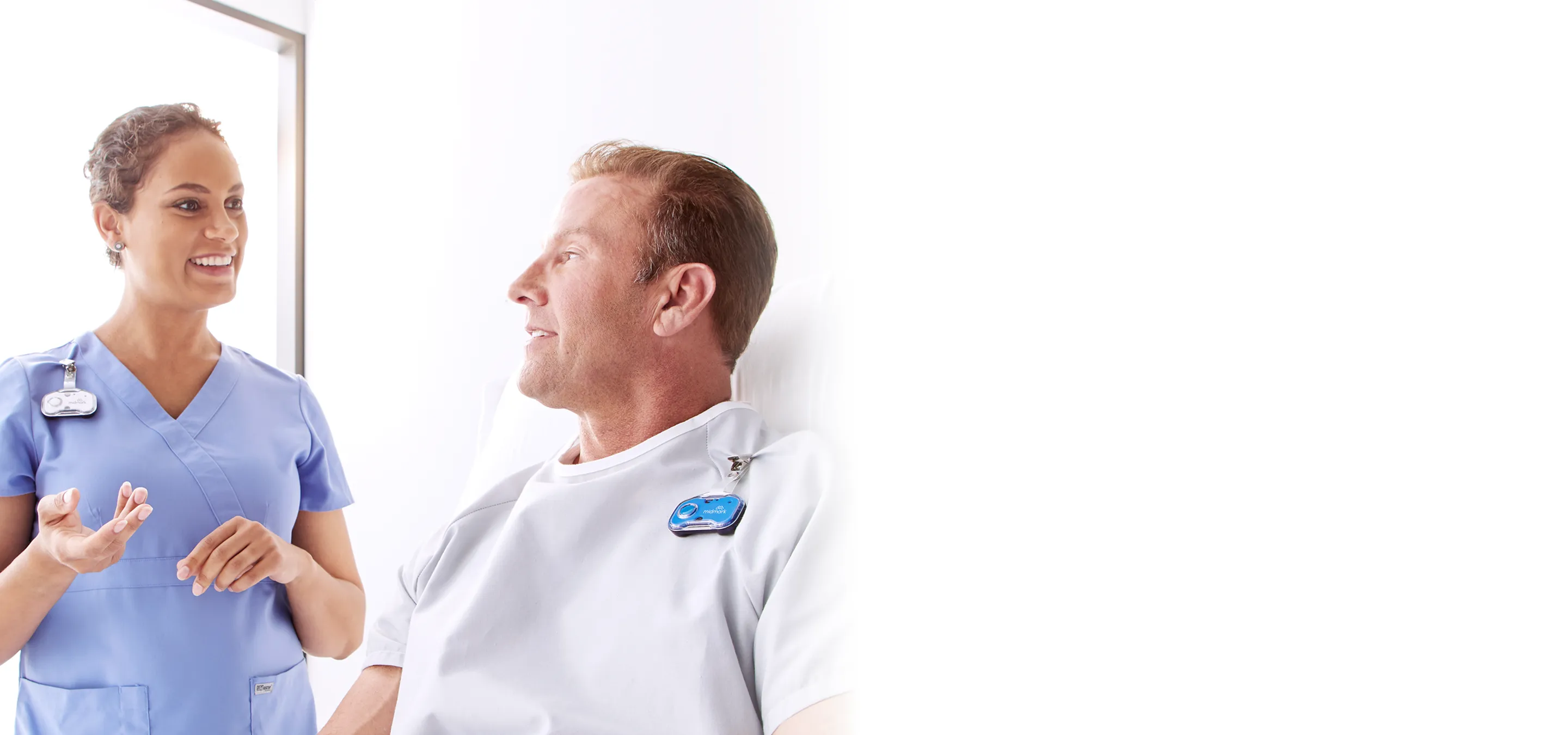 nurse and patient interacting wearing midmark rtls badges